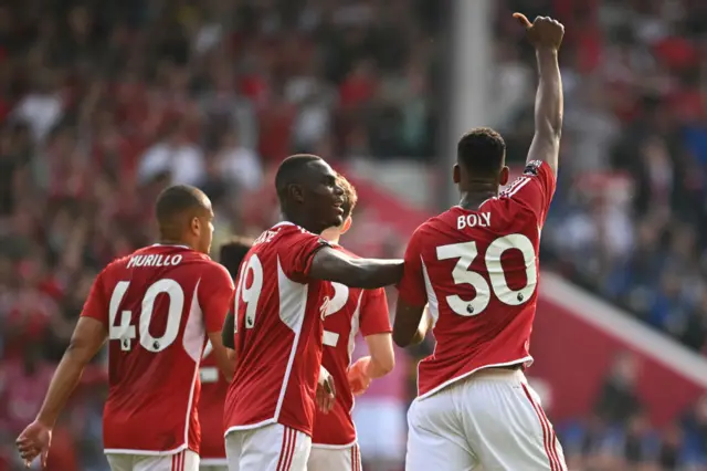 Willy Boly (R) celebrates scoring the team's first goal with Nottingham Forest's French defender #19 Moussa Niakhate during the English Premier League football match between Nottingham Forest and Chelsea