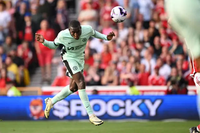 Nicolas Jackson of Chelsea scores his team's third goal during the Premier League match between Nottingham Forest and Chelsea FC