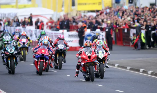 Davey Todd leads Glenn Irwin off the line