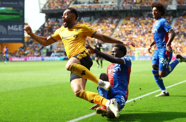 Naouirou Ahamada fouls Wolverhampton Wanderers' Matheus Cunha