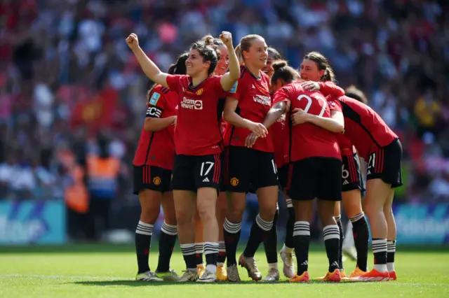 Lucia Garcia of Manchester United celebrates scoring her team's fourth goal with teammates during the Adobe Women's FA Cup Final match between Manchester United and Tottenham Hotspur