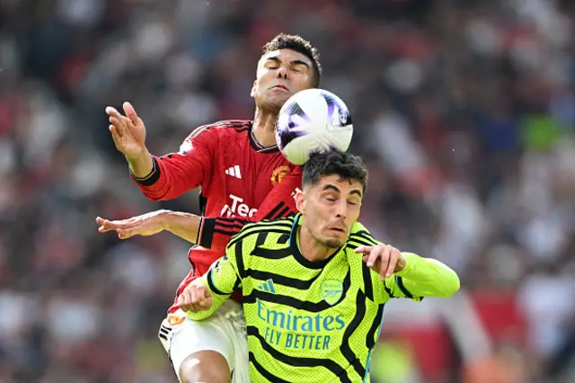 Casemiro of Manchester United competes for a header with Kai Havertz