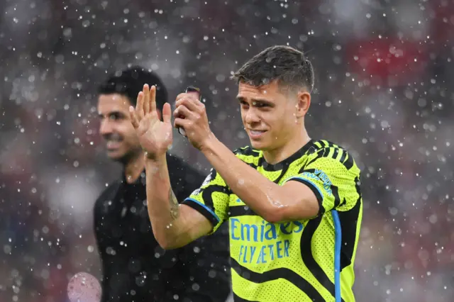 Leandro Trossard of Arsenal applauds the fans as he celebrates victory after the Premier League match between Manchester United and Arsenal FC