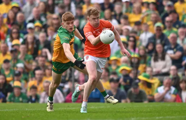 Donegal's Ciaran Moore in pursuit of Armagh forward Conor Turbitt