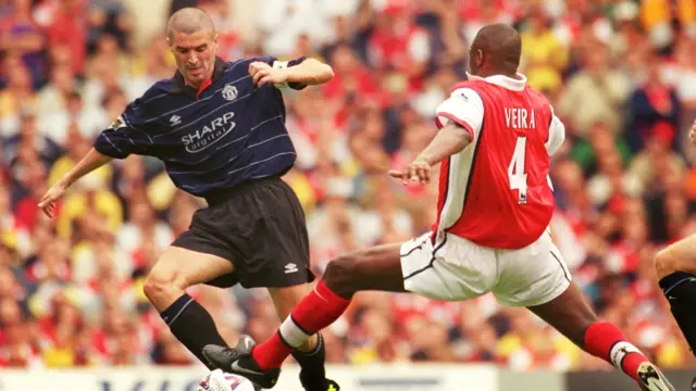 Arsenal's Patrick Vieira lunges in on Manchester United's Roy Keane