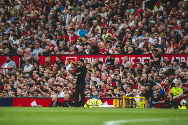 Manager Mikel Arteta of Arsenal FC watches from the touchline during the Premier League match between Manchester United and Arsenal FC