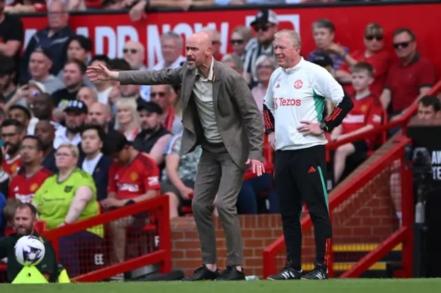 Erik ten Hag, Manager of Manchester United, reacts as Steve McClaren, Assistant Coach of Manchester United, looks on during the Premier League match between Manchester United and Arsenal FC