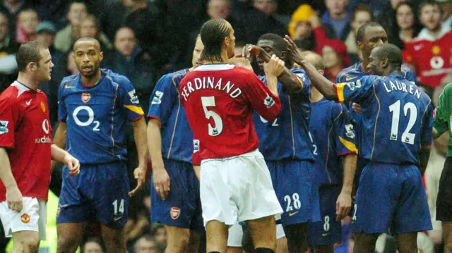 Manchester United and Arsenal players scuffle