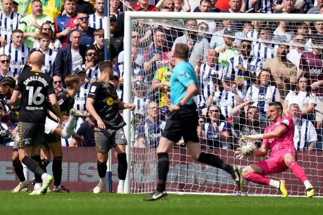 Southampton keeper Alex McCarthy saves from Grady Diangana