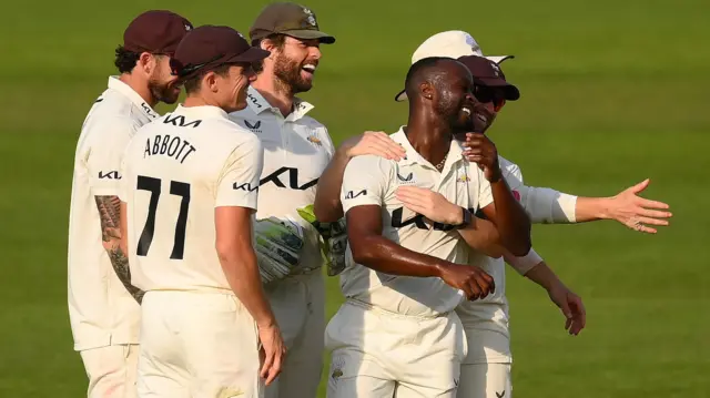 Surrey celebrate a wicket