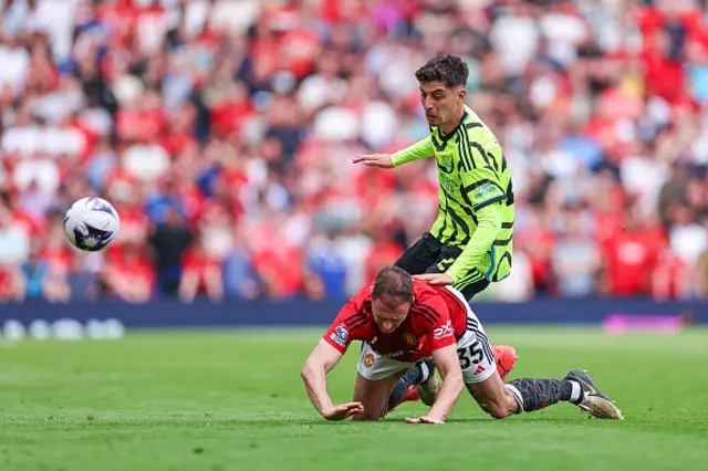 Kai Havertz of Arsenal and Jonny Evans dual for the ball