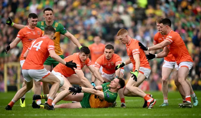 Donegal's Ciaran Thompson is surrounded by Armagh players at Clones