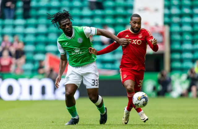 Hibernian's Rocky Bushiri and Aberdeen's Junior Hoilett