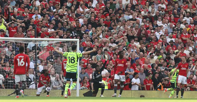 Aaron Wan-Bissaka, Andre Onana, Kobbie Mainoo, Jonny Evans of Manchester United react to conceding a goal