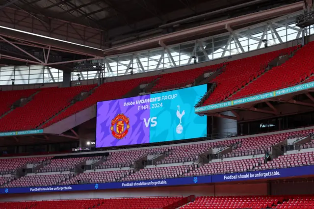 Wembley scoreboard showing the team crests