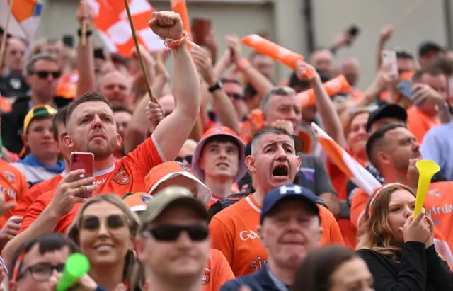 Armagh supporters celebrate the score