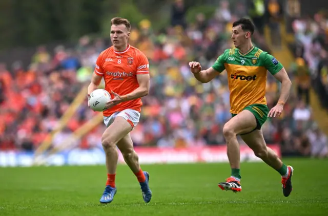 Rian O'Neill of Armagh in action against Michael Langan of Donegal