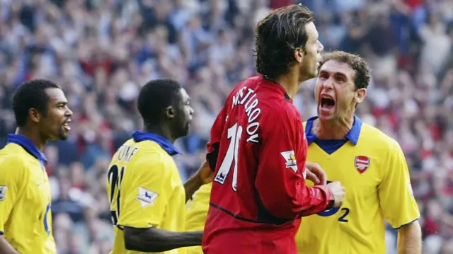 Arsenal's Martin Keown goads Manchester United's Ruud van Nistelrooy after his penalty miss in 2003