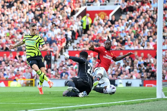 Leandro Trossard scores past Andre Onana