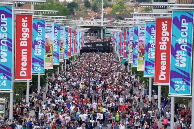 Fans flock down Wembley way to the stadium