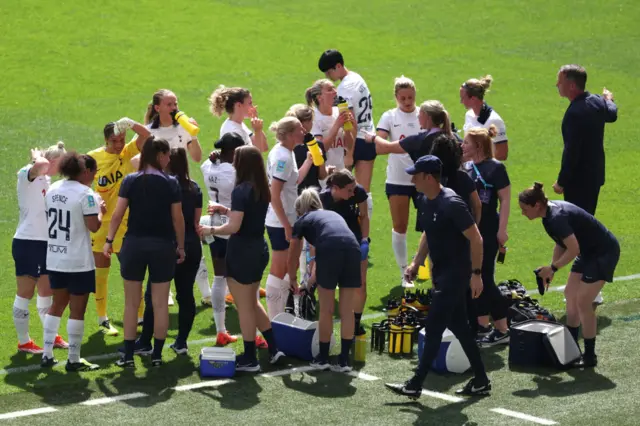 Players of Tottenham Hotspur pause for a drinks break during the Adobe Women's FA Cup Final match between Manchester United and Tottenham Hotspur