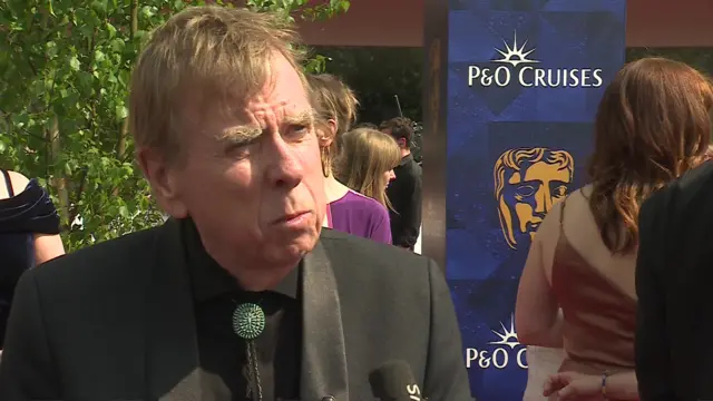 Timothy Spall talks to the BBC on the red carpet ahead of the baftas