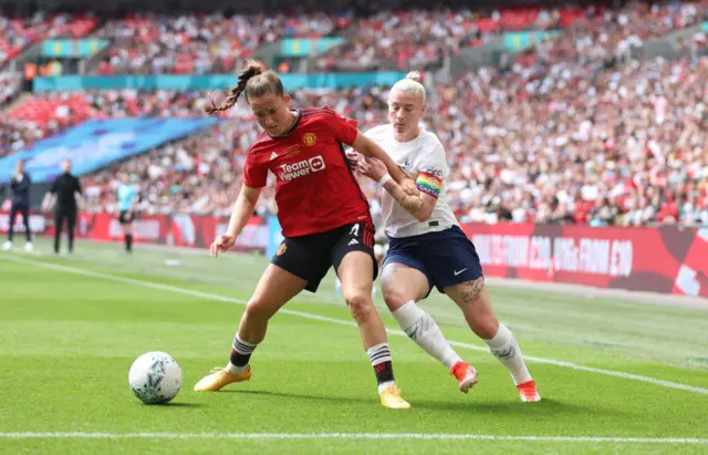 Maya Le Tissier of Manchester United battles with Bethany England of Tottenham Hotspur