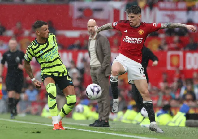 Alejandro Garnacho of Manchester United in action with Ben White of Arsenal during the Premier League match between Manchester United and Arsenal FC