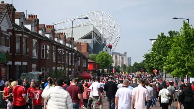 Manchester United fans walk down to Old Trafford