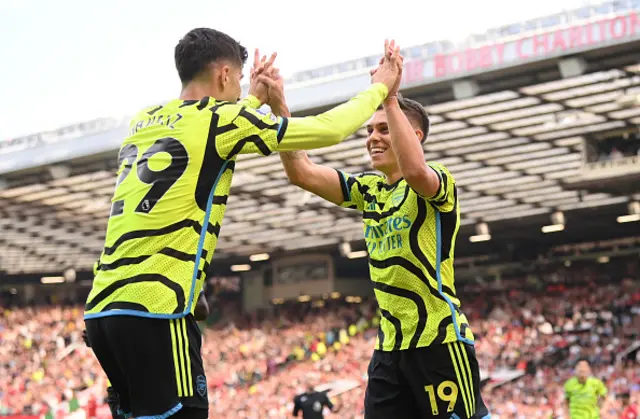 Leandro Trossard of Arsenal celebrates scoring his team's first goal with teammate Kai Havertz