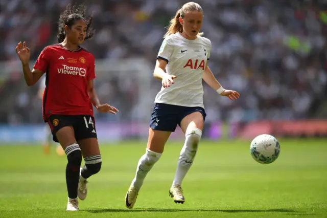 Amanda Nilden of Tottenham Hotspur is put under pressure by Jayde Riviere of Manchester United during the Adobe Women's FA Cup Final match between Manchester United and Tottenham Hotspur