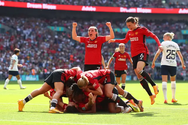 Ella Toone of Manchester United celebrates their 2nd goal as her teammates pile on