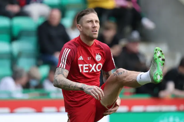 Aberdeen's Angus MacDonald warms up