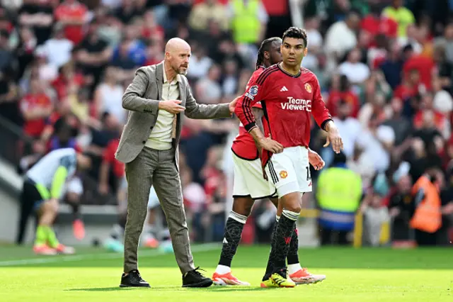 Erik ten Hag, Manager of Manchester United, speaks with Casemiro