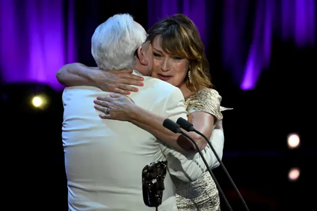 Lorraine Kelly hugs Brian Cox as he presents her with a Bafta special award for her 40-year career