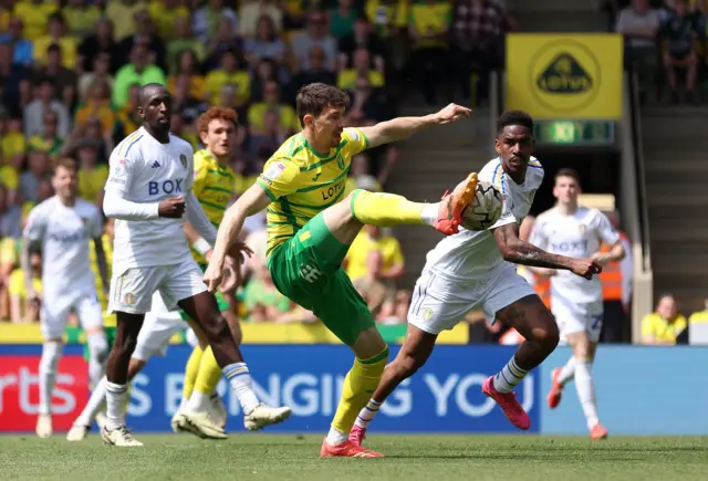 Christian Fassnacht cannot get  shot off during the game against Leeds