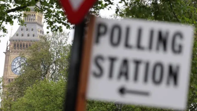 Polling station sign is seen with Big Ben in the background