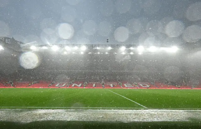 Rain falling down on the pitch at Old Trafford