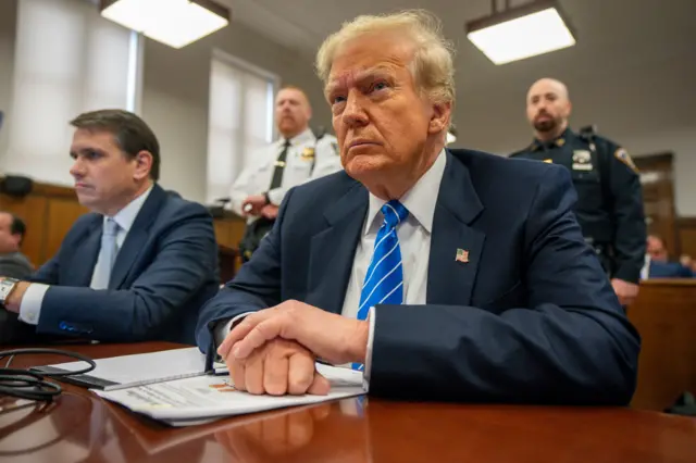 Trump seated at defence table