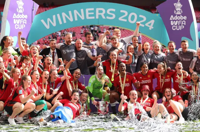 Manchester United players celebrate with the FA Cup