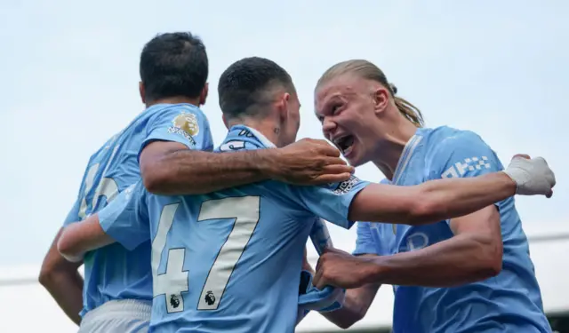 Manchester City's Erling Haaland, Rodri and Phil Foden celebrate