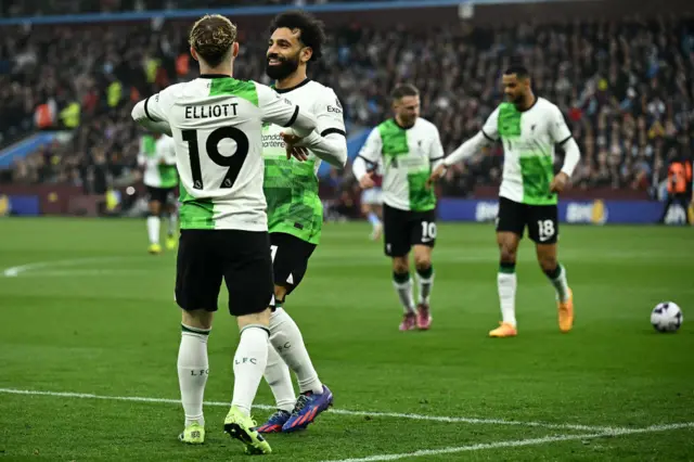 Harvey Elliott celebrates with Mo Salah