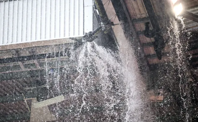 Water falling from the roof at Old Trafford