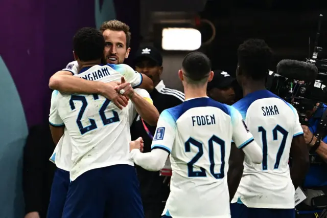 Harry Kane celebrates goal for England with Jude Bellingham, Bukayo Saka and Phil Foden