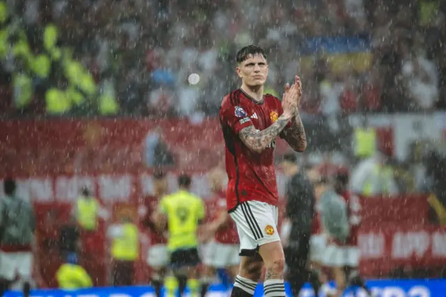 Alejandro Garnacho applauds fans as he leaves the field