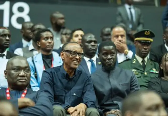 Rwanda's President Paul Kagame and Senegal President Bassirou Diomaye Faye watch basketball game in Dakar on 12 May 2024