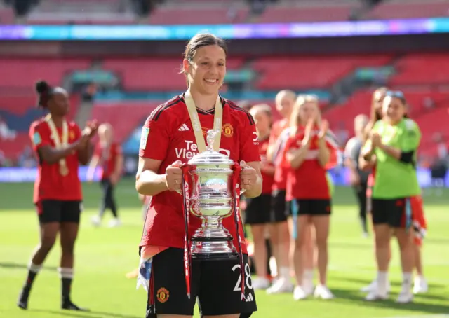 Rachel Williams holds the Women's FA Cup trophy