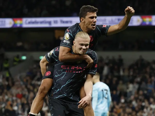 Rodri celebrates with Haaland