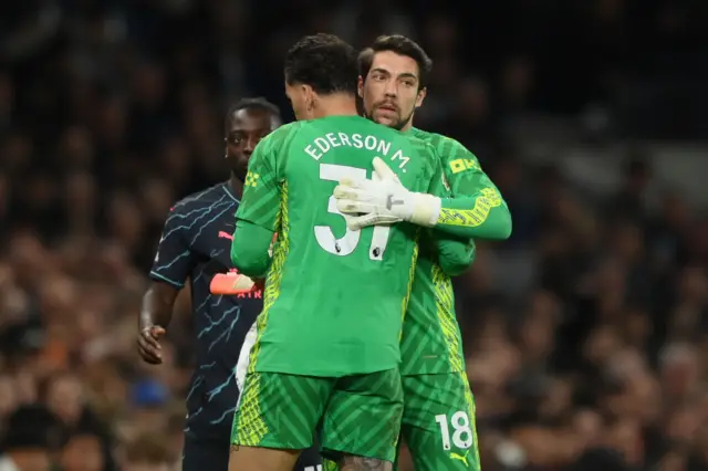 Ortega and Ederson embrace as one replaces the other on the field