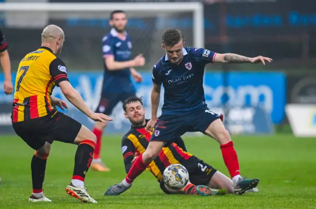 Partick Thistle's Jack McMillan tries to tackle Raith Rovers' Kyle Turner during a cinch Premiership play-off semi-final first leg match between Partick Thistle and Raith Rovers at Wyre Stadium at Firhill, on May 14, 2024, in Glasgow, Scotland.